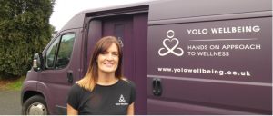 Cheryle standing in front of the YOLO Wellbeing van
